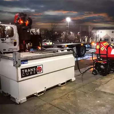 transcube refueling a flat bed trailer behind
